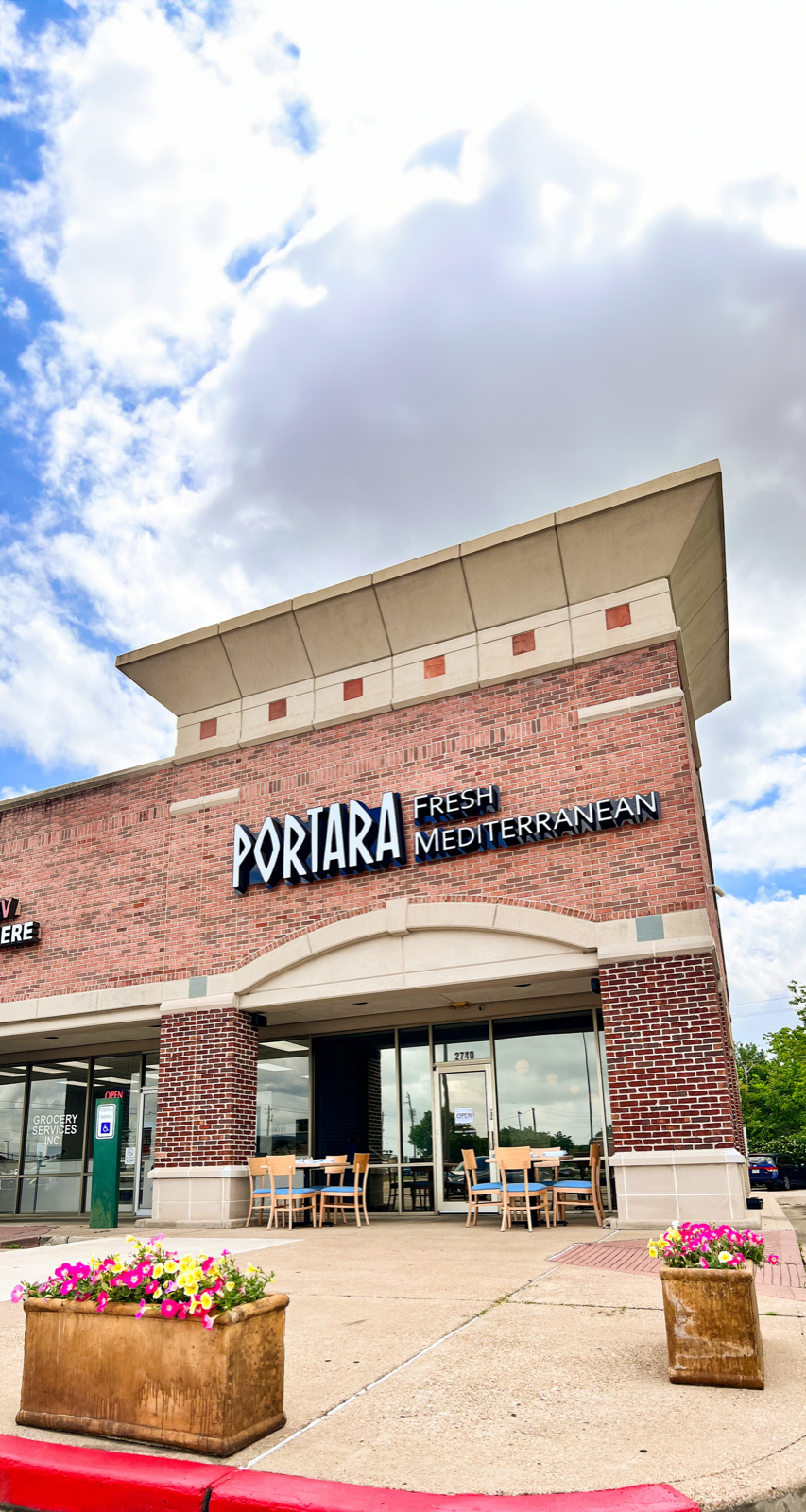 Portara storefront with patio seating.